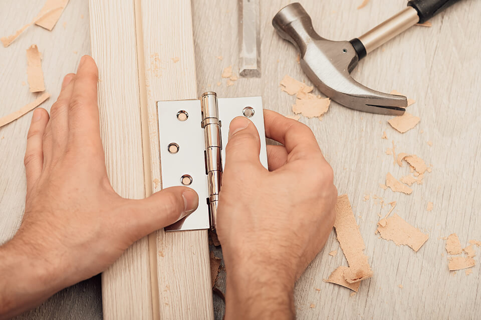 Fitting new hinges to a door