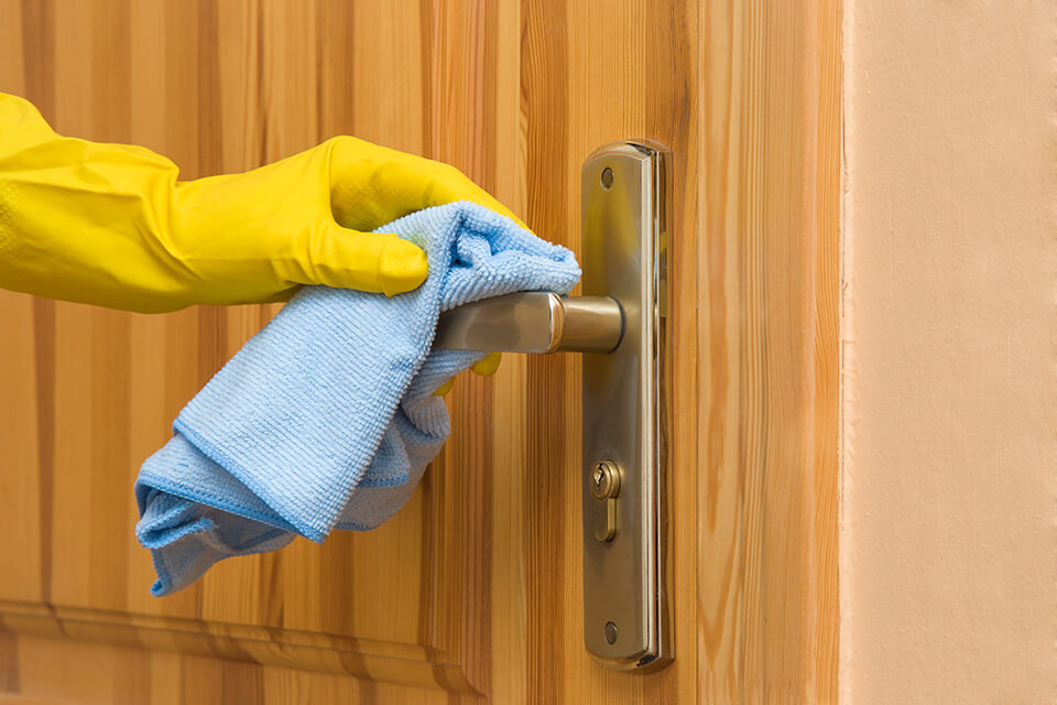 Cleaning an internal door with a damp cloth