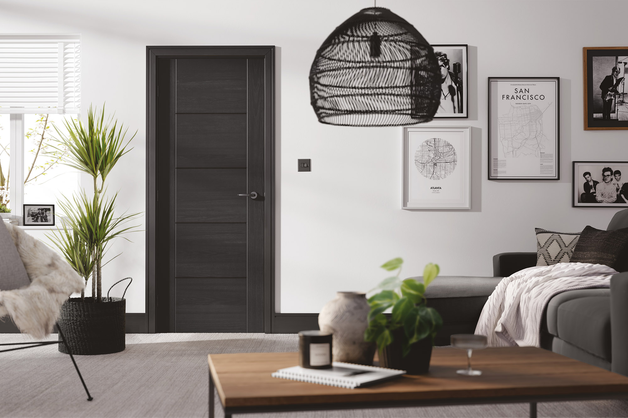 black internal doors in stylish room with black accents and black door handles