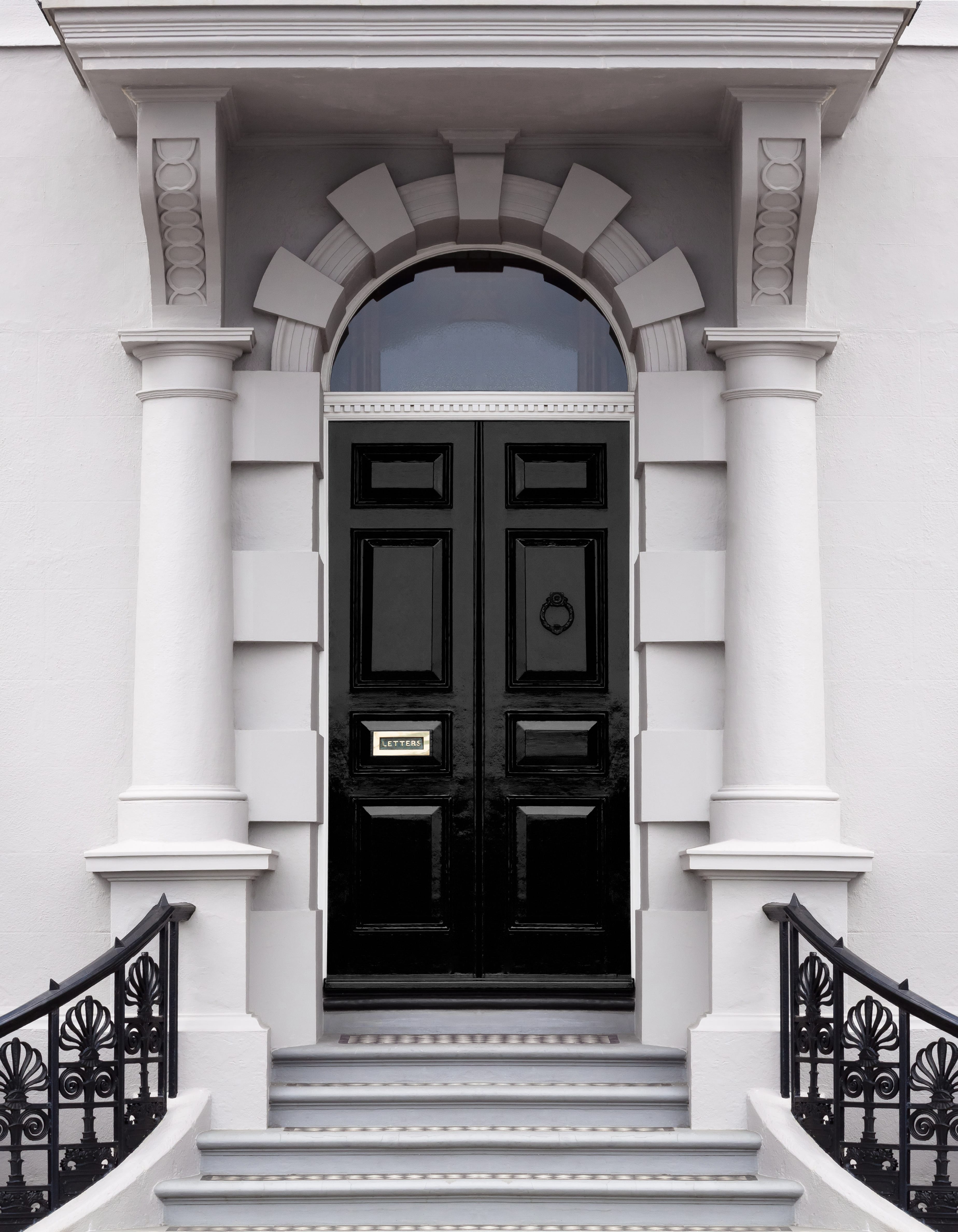 front door painted with black gloss