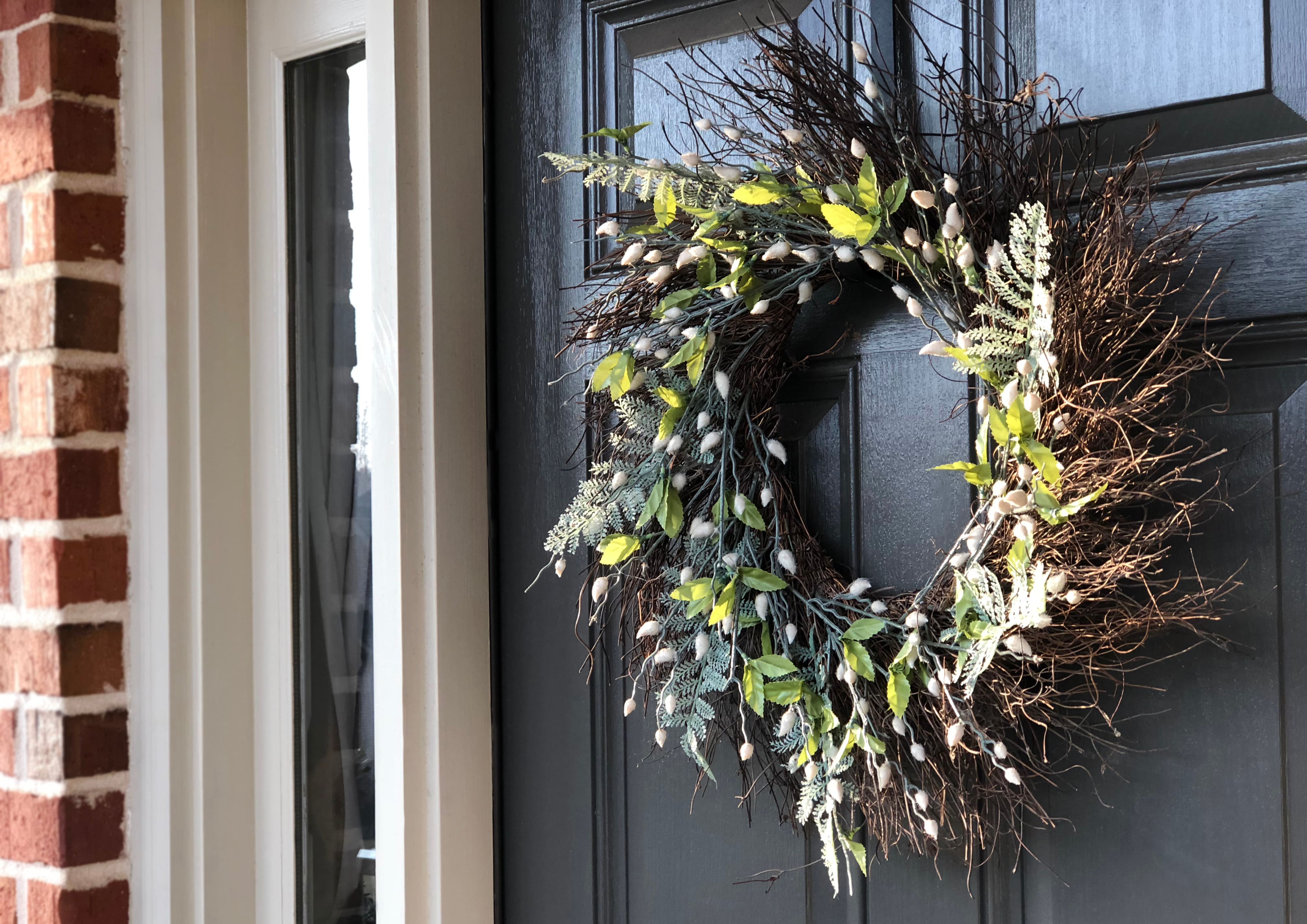 front door with striking wreath