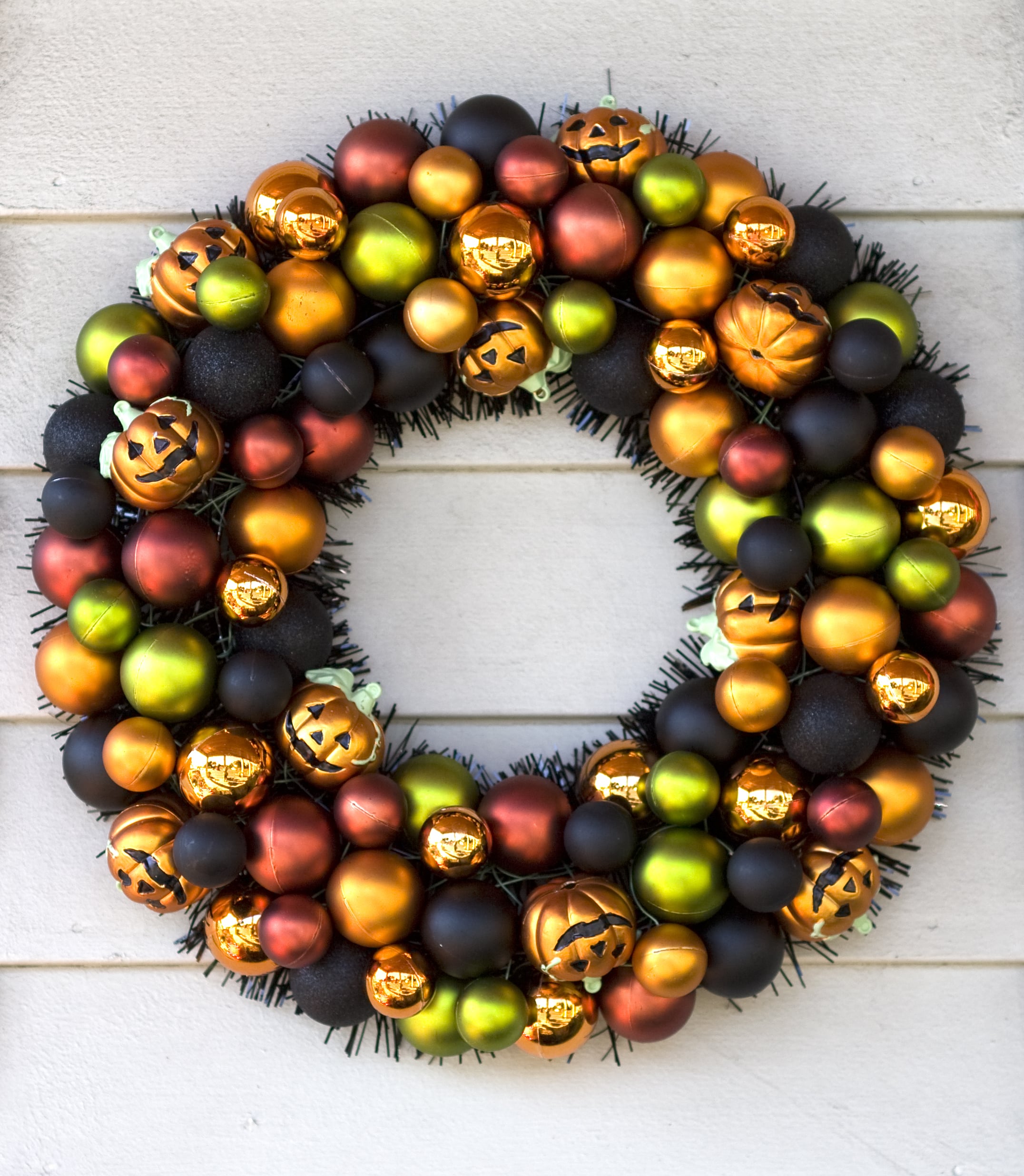 Halloween wreath made from baubles with pumpkins